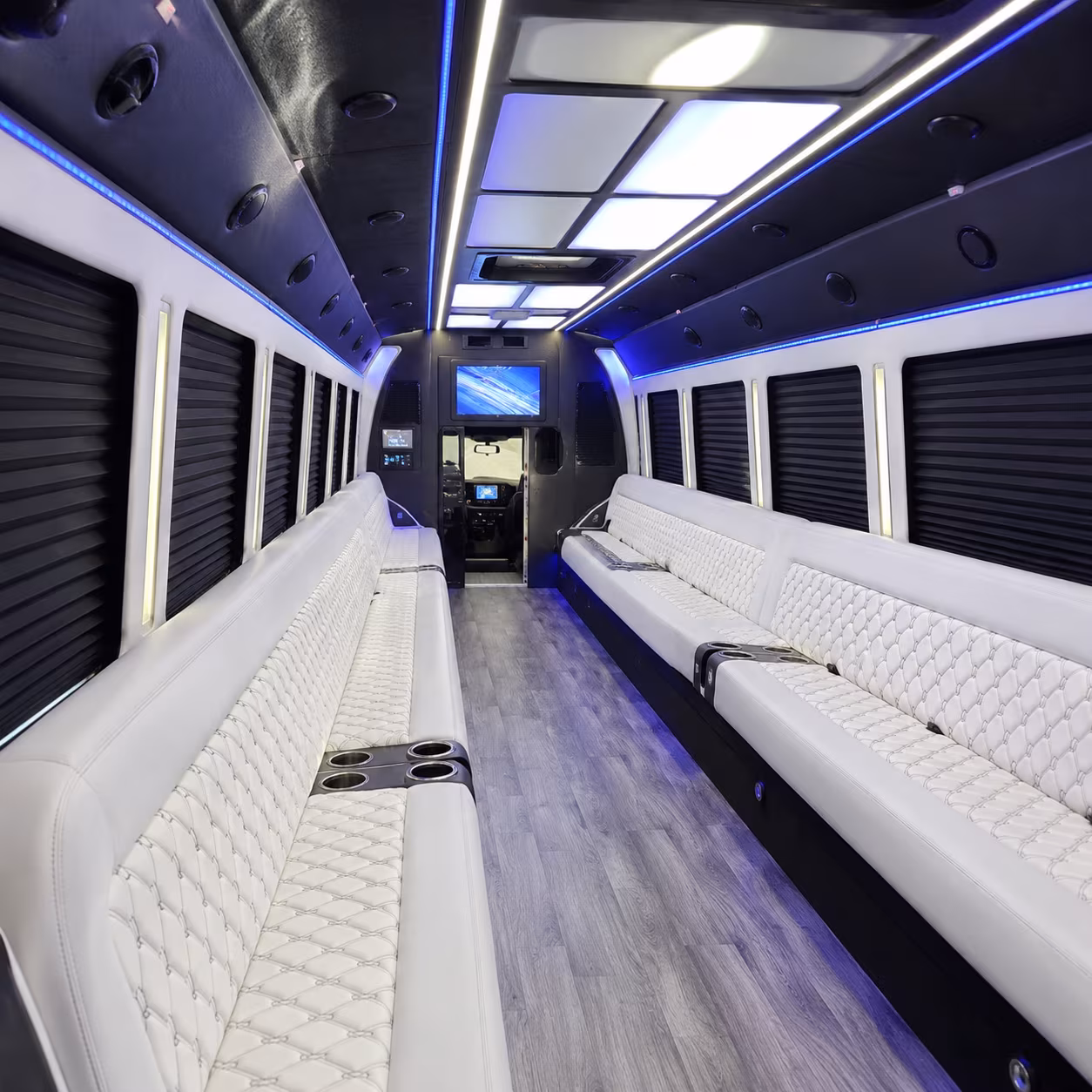 Friends laughing during a party bus celebration in Birmingham